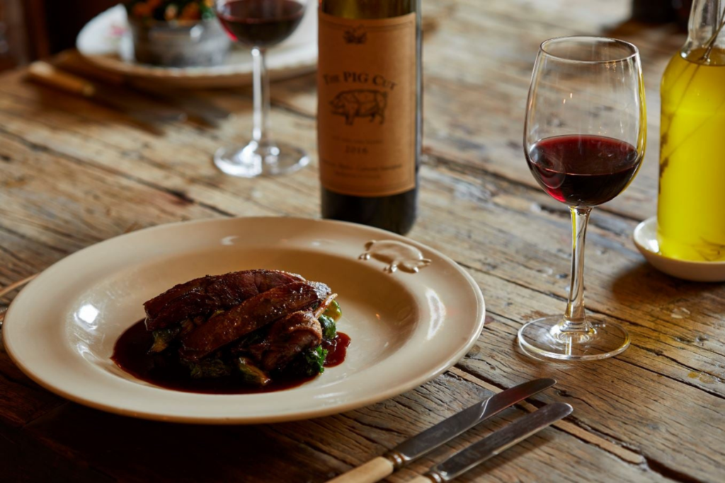 Ten Private Membership - Ten Members' Choice: Best Boutique Hotels In The UK A plate of food and glass of wine at The Pig