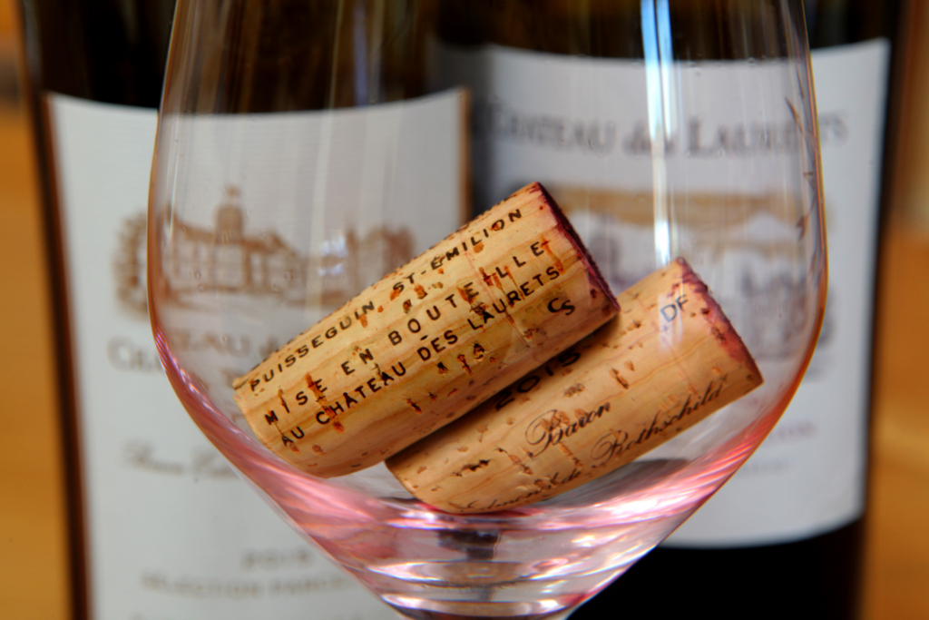 St Emilion corks in an empty glass