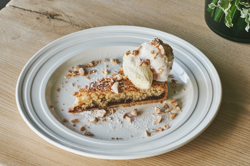 A slice of quince tart with ice cream