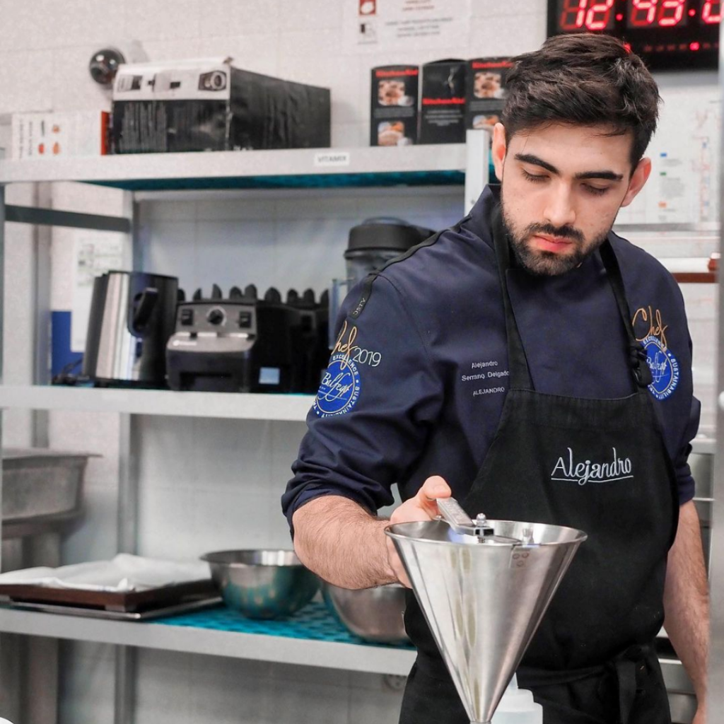 Alejandro Serrano cooking in a kitchen