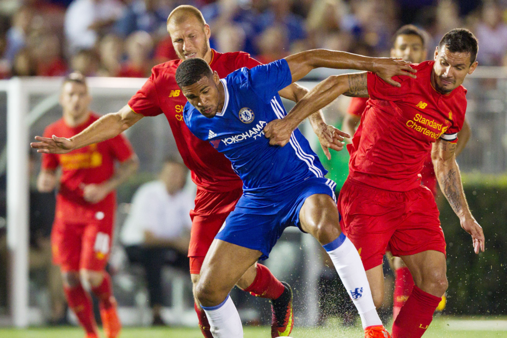 Players in a Chelsea vs Liverpool match