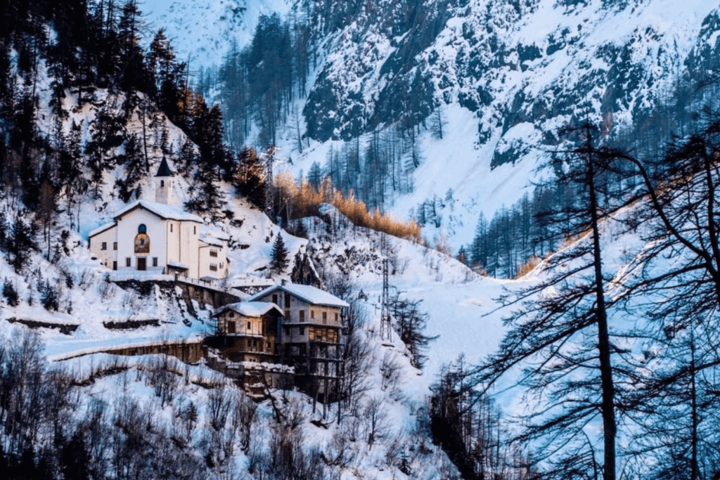 Mountain hut covered in snow